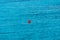 Red buoy in the sea. The limit of the permitted place for swimming