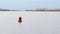 Red buoy on a white river