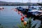 Red buoys and boats on the Zurich lake. Covered boats anchored in port on sunny summer day, vertical image