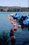 Red buoys and boats on the Zurich lake. Covered boats anchored in port on sunny summer day, vertical image