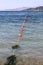 Red buoys on the sea surface. Swimming restrictions for people.