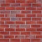 Red burned brick wall seamless background