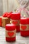 Red burning candles over the wood background. Valentine