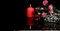 Red burning candles, red and white flowers, berries, greeting card on black background. Love and passion concept. Copy space for