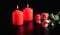 Red burning candles and roses  greeting card on black background. Love and passion