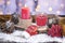 Red burning candles, snowy cones, dried oranges, rowan, Christmas lollipop, woolen scarf.