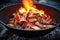 red burning embers cooking potatoes in a deep fire pit