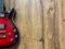 red burst electric guitar made from a genuine alder wood Popular musician on veneer brown wood background with copy space