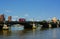 Red bus on Battersea Bridge, London, UK