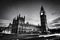 Red bus, Big Ben and Westminster Palace in London, the UK. at night. Black and white