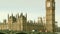 Red bus crosses the Westminster Bridge, Big Ben