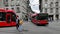 Red buses crossing