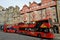 Red buses on the streets of Edinburgh the capital of Scotland built on seven hills