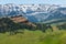 Red butte snowcapped mountains meadow