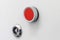 Red button lock on the gray panel