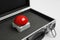 Red button of nuclear weapon in suitcase on white background. War concept