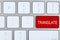 Red button with word TRANSLATE on computer keyboard, top view