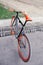 Red bycicle parked in park top view