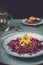 Red cabbage salad with fried apples caramelized with cinnamon