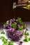 Red cabbage salad with parsley, glass bowl, organic food, olive oil pouring from the bottle