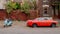 Red cadillac and blue Vespa