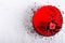 Red Cake with rose on white concrete background. Top view. Valentine`s Day. Free space for your text.