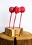 Red cakepops  on the wooden old tree cut, white background