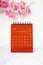 The Red calendar July 2023. Desk calendar for year 2023 and pink color orchid