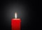 Red Candle with Bright Light Effect on Black Background - Graphic Illustration!