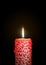 Red Candle Burning in the Dark. Surface is Decorated with Flourish Texture!