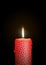 Red Candle Burning in the Dark. Surface is Decorated with Starlet Texture!