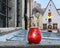 red  candle cup and city clock   on medieval wall at roof in Old town of Tallinn people walk at evening travel to