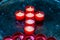 Red candles arranged in a Cross