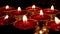 Red candles are burning. Light in the darkness. Melting candles