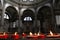 Red candles and church interior,venice, italy