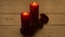 Red candles light with rose on white wooden desk