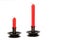 Red candles on a white background. Antique Candle Holders