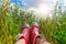 Red Canvas Shoes Amidst Daisy Field and Blue Sky