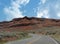 Red canyons and rock platforms along winding roads in Wyoming