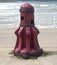 Red capstan winch by sea