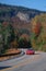 Red car on autumn road