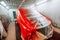 Red car being paint in special paint booth, Car painting details