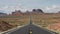 Red car on highway 163 at monument valley