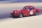 A red car in the Laguna-Seca Classic Car Race in Carmel, California