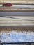 Red car on road light snow covered ground