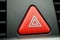 Red car Warning button with a white triangle switching all the vehicle outdoor indicators as a symbol of caution, warning and po