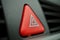 Red car Warning button with a white triangle switching all the vehicle outdoor indicators as a symbol of caution, warning and po