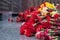 Red carnation flowers at the memorial to fallen soldiers in the world war II