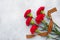 Red carnations and St. George ribbon on a concrete background. Symbol may 9, victory day Copy space