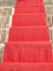 Red carpet catwalk with antique brick background